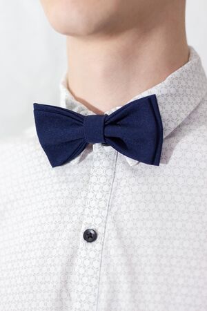 close up of blew bow tie on young menの写真素材