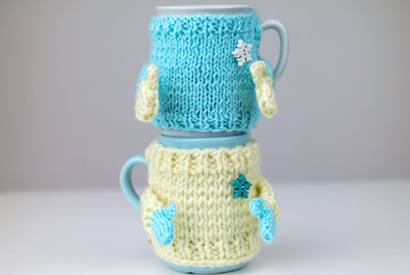Two cups in sweater. A couple of cups. Cups for two.の写真素材