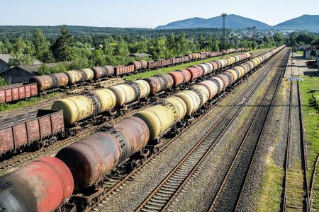Freight trains.Railroad train of tanker cars transporting crude oil on the tracks.の写真素材