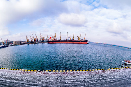 Cargo ship in the port in Winter.