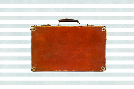 Old shabby brown suitcase with angle bars on watercolor blue stripes background.