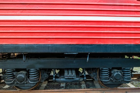 Detail of red fire train on the track of the railway station.の写真素材