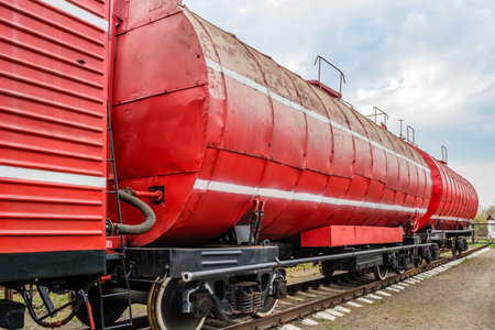 Red fire train on the track of the railway station.