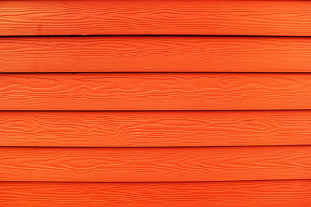 The red wooden texture background. Close up photo.
