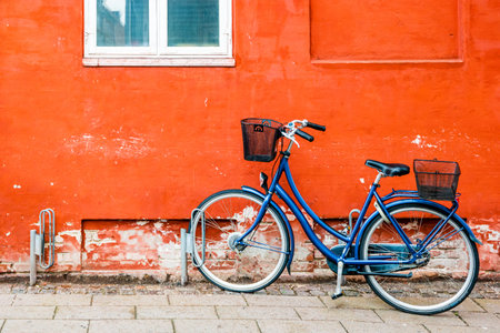 Exterior architecture. Bicycles in front of orange facace in Helsingor, Denmark.の写真素材