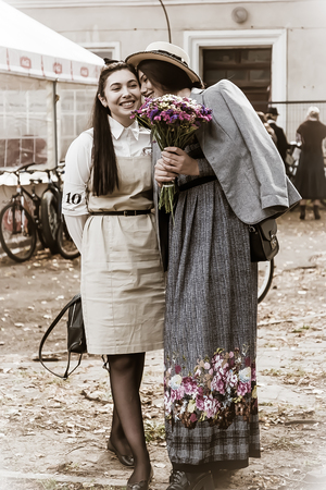 Ivano-Frankivsk, Ukraine - September 28, 2019: Retro cruise de Frankivsk. People in retro clothes participating in bicycle tweed run Retro cruise.のeditorial素材