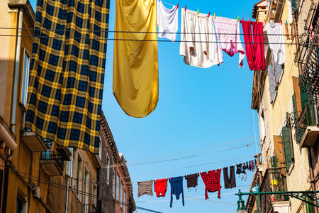 Laundry hanging out of a typical Venetian facade. Italy.の写真素材