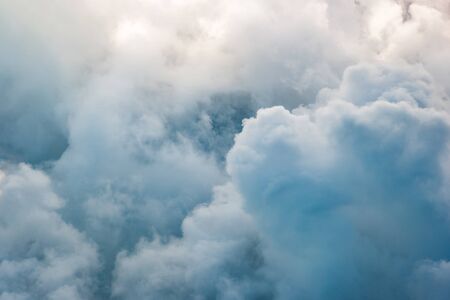 Fluffy white clouds against the blue sky.の写真素材