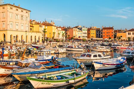 Rovinj, Croatia - October, 2019: Boats and their reflection in the water in Rovinj, Croatia.の写真素材