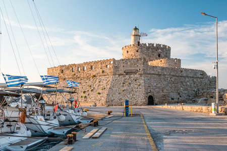 Rhodes, Greece - June 2021: Agios Nikolaos fortress on Rhodes at sunset.のeditorial素材