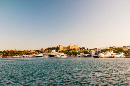 Old City of Rhodes Island at sunset. View from the sea.の写真素材