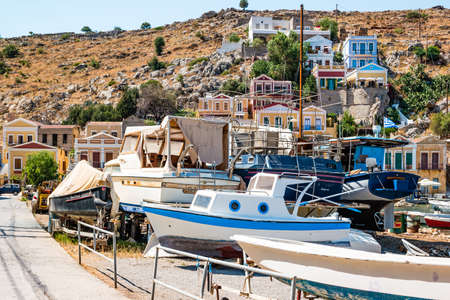 Symi, Greece - June 2021: Fishing boats on land on Symi Island near Rhodes, Greece.のeditorial素材
