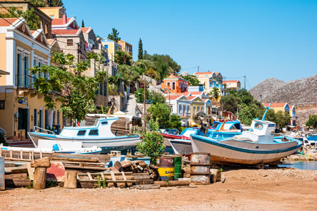 Symi, Greece - June 2021: Fishing boats on land on Symi Island near Rhodes, Greece.
