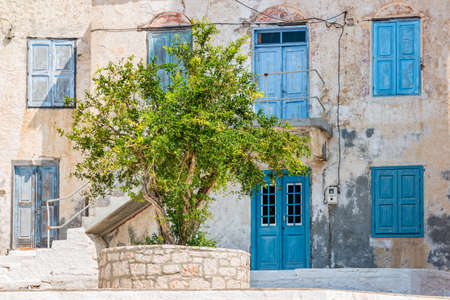 Colorful house on the island of Halki, part of the Dodecanese island chain, Greece.の写真素材