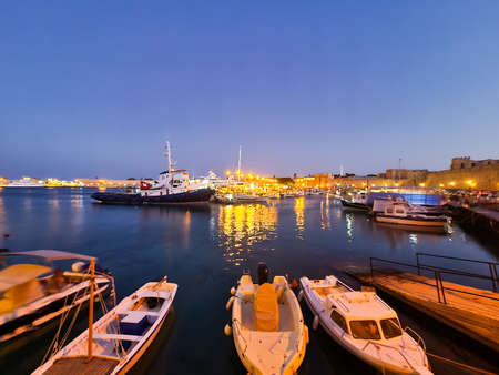 Rhodes, Greece - June 2021: Boats in the port of Rhodes at night.のeditorial素材