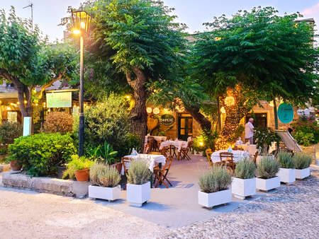 Rhodes, Greece - June 2021: Blooming streets of the old town of Rhodes in the evening, Greece.のeditorial素材
