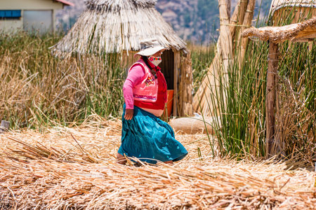 Uros, Peru - October 2021: People on the floating Uros Islands on Lake Titicaca in Peru.のeditorial素材