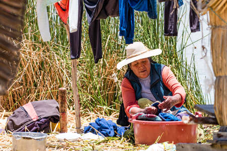Uros, Peru - October 2021: People on the floating Uros Islands on Lake Titicaca in Peru.のeditorial素材