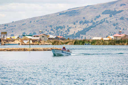 Uros, Peru - October 2021: People on the floating Uros Islands on Lake Titicaca in Peru.のeditorial素材