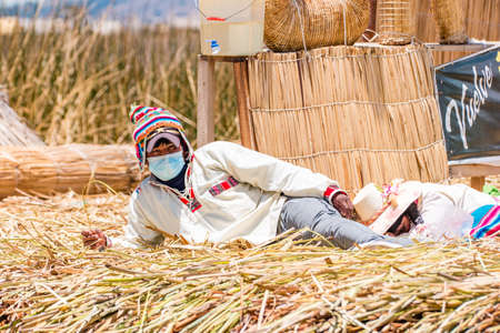 Uros, Peru - October 2021: People on the floating Uros Islands on Lake Titicaca in Peru.のeditorial素材