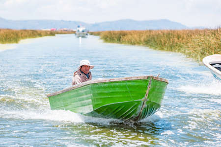 Uros, Peru - October 2021: People on the floating Uros Islands on Lake Titicaca in Peru.のeditorial素材
