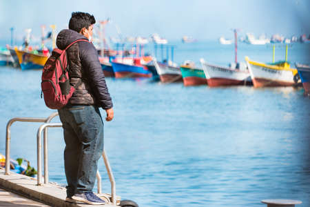 Paracas, Peru - October 2021: Multicolored boats in the bay of Paracas in Peru.のeditorial素材