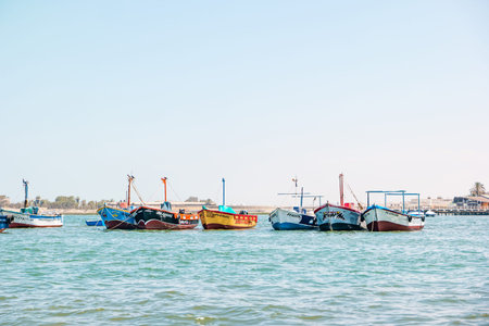 Paracas, Peru - October 2021: Multicolored boats in the bay of Paracas in Peru.