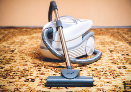 Vacuum cleaner on a Persian rug. top viewの写真素材