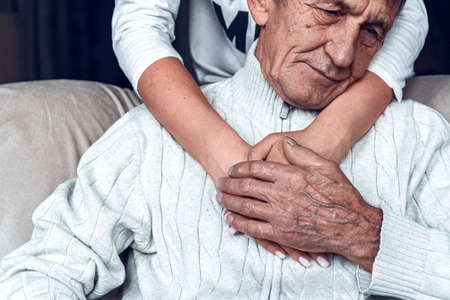 Taking care of the elderly during a pandemic COVID-19. Self-isolation of the elderly. Support for older people during quarantineの写真素材