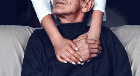 Taking care of the elderly during a pandemic COVID-19. Self-isolation of the elderly. Support for older people during quarantineの写真素材