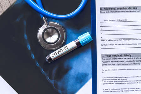 Doctor s table, medical record with the results of a blood test, smear and X-ray of the patient s lungs covid-19の写真素材