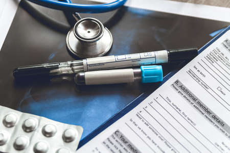 Doctor s table, medical record with the results of a blood test, smear and X-ray of the patient s lungs covid-19の写真素材