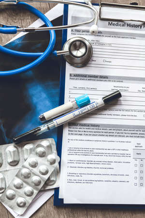 Doctor s table, medical record with the results of a blood test, smear and X-ray of the patient s lungs covid-19の写真素材