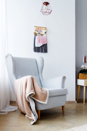 Stylish armchair in a bright cozy living room