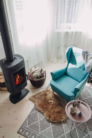 Cozy living room with fireplace, armchair and carpet, top viewの写真素材