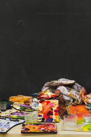 Set of many palettes on the artist's workplace in the studioの写真素材