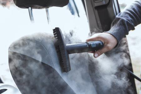 cleaning and disinfecting by steam of the car interior and a car seats with a steam cleanerの写真素材
