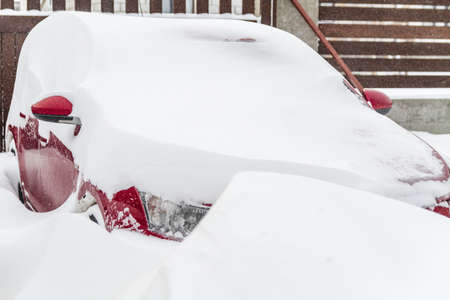 The Snow covered parked car in a snowdriftの写真素材