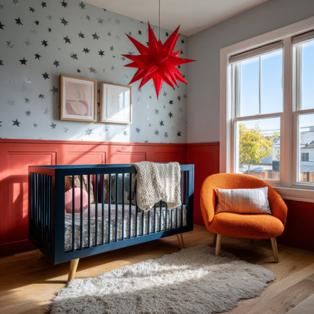 A cozy nursery with a red star decoration, a blue crib, and an orange chair. The room is filled with soft light, creating a warm atmosphere.の素材