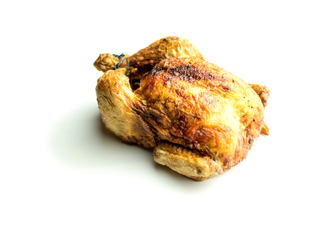 Baked whole chicken isolated on whiteの写真素材