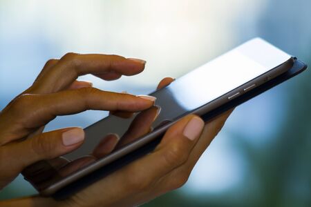 Woman using digital tablet, closeupの写真素材