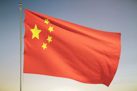 The Chinese flag waving on a sunset sky background . Close Upの写真素材