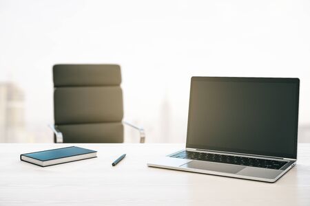 Morning desktop with laptop, armchair and a window with a city view. Mockup. 3D Renderingの写真素材