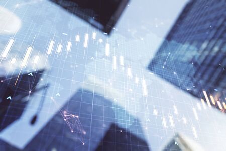 Double exposure of abstract financial graph with world map on office buildings background, financial and trading conceptの写真素材