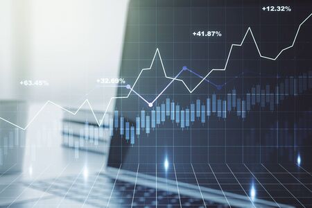 Double exposure of abstract creative financial diagram on modern laptop background, banking and accounting conceptの写真素材