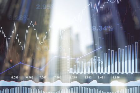 Double exposure of abstract financial diagram on office buildings background, banking and accounting conceptの写真素材