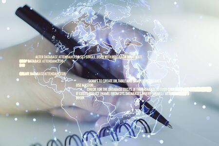 Abstract creative coding illustration with world map and man hand writing in diary on background, international software development concept. Multiexposureの写真素材