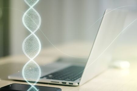 Creative concept with DNA symbol illustration on modern laptop background. Genome research concept. Multiexposureの写真素材