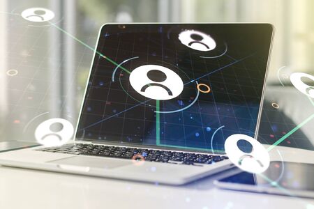 Social network concept with modern laptop on background. Multiexposureの写真素材