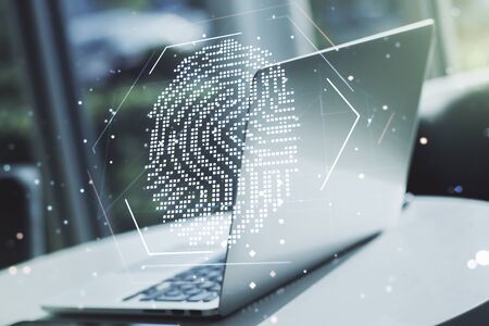 Multi exposure of abstract creative fingerprint illustration on modern laptop background, digital access conceptの写真素材
